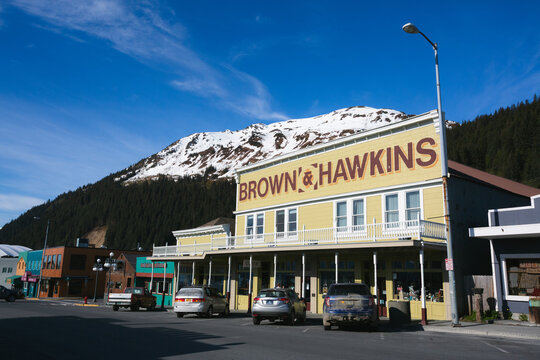 Businesses downtown with snowy mountains in the background. Seward, Alaska &ndash; May 2022