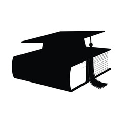 A graduation cap is placed on the book.