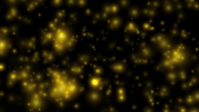 Abstract gold glitter particles on black background with shining sparkling bokeh. Dynamic floating motion seamless loop animation