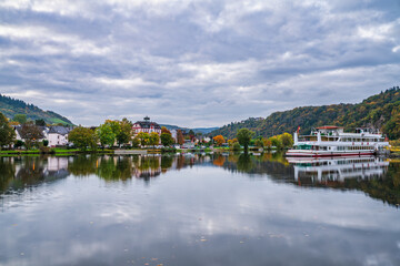 Fototapeta premium Bullay village at dawnreflected in Moselle river in Germany. Europe