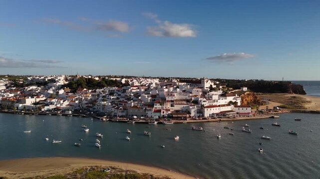 Aerial View of Anchored Boats by Ferragudo Traditional Fishing Town on Arade River