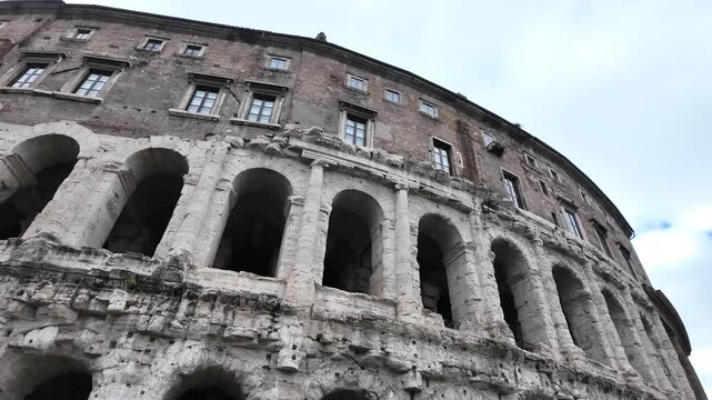 Slow motion macro of the ancient travertine arches of Teatro di Marcello, Rome