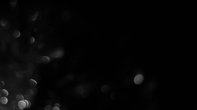 Gray bokeh on black background