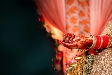 Indian Bride's Hands Adorned with Henna and Traditional Bangles