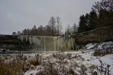 Frozen Jagala waterfall on a cold cloudy winter day in Harju county, Estonia 