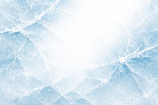 Icy crystal fracture surface in pale blue tones, frosted glass crack pattern with bright light burst, cool translucent texture, winter sparkle highlights and clean luminous shards effect