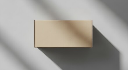 Minimal Beige Box Cast in Soft Light on White Surface