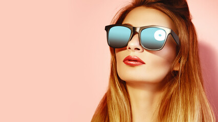 Caucasian Woman With Mirrored Sunglasses, Long Blonde Hair, Red Lipstick, Pink Studio Backdrop,...