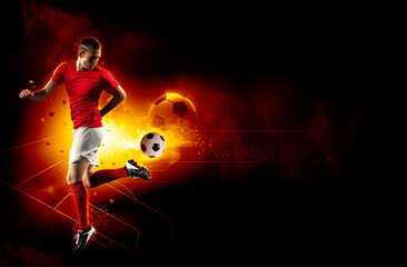 Football player in dynamic action kicking a ball