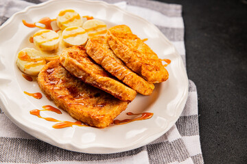 French toast sweet toasts with syrup bread fried in egg breakfast tasty snack fresh gourmet food background on the table rustic food top view copy space