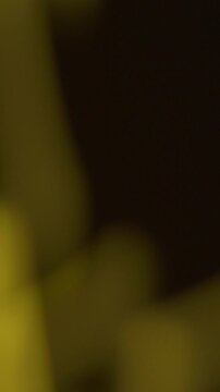 Shadowy Vertical Smooth Film Burn Transition, Abstract Yellow Light Motion Shadows in Blur. perfect for mystery story