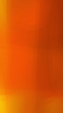 Orange Vertical Smooth Film Burn Transition, Vibrant Orange Red Gradient Video with Warm Glow. great for energetic clip