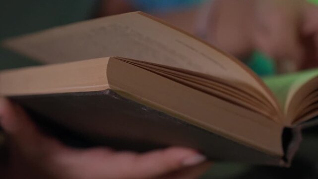 Manual Page Flipping. Gentle Lights And Textured Pages. Close Examination Of Textured Pages With Gentle Illumination. Handturning Pages Illuminated By Soft Background Lights And Textured Edges