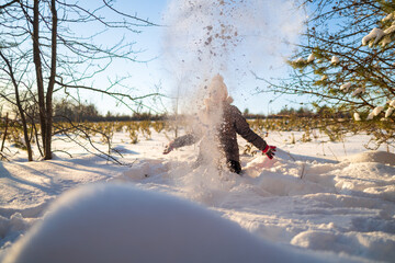 Little Girl Exploring Snow During Winter Walk