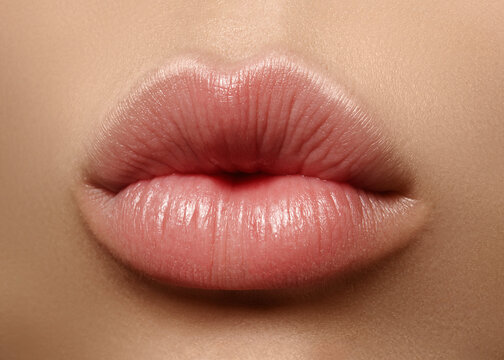 Close-up perfect natural lip makeup beautiful female mouth. Plump sexy full lips. Macro photo face detail. Perfect clean skin, fresh lip make-up. Beautiful spa tender lips. Valentines Day, Love Kiss