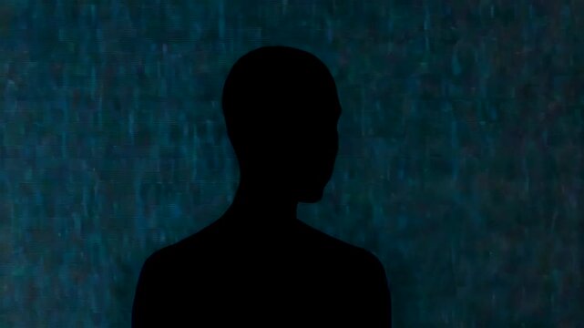 Dark Human Silhouette Portrait Against Textured Blue Background with Minimal Lighting and Mysterious Mood