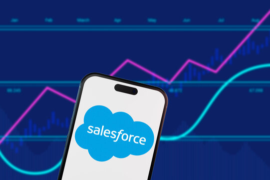 Brooklyn.New York.USA-13.02.2026: Salesforce logo on a smartphone screen with financial growth charts. Concept for cloud software stocks and CRM market trading