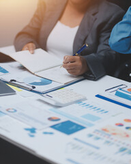 Auditor and accountant team working in office, analyze financial data and accounting record with calculator. Accounting company provide finance and taxation planning for profitable cash flow.