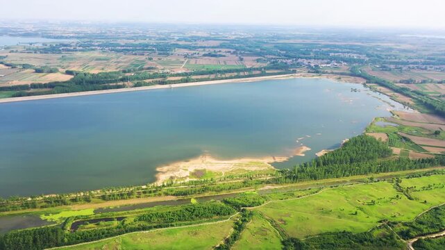 Aerial View of Large Lake with Surrounding Farmland and Wetlands