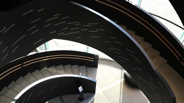 Spiral staircase top view looking down abstract architectural geometry circular structure with repeating steps minimalist interior design strong symmetry and graphic perspective