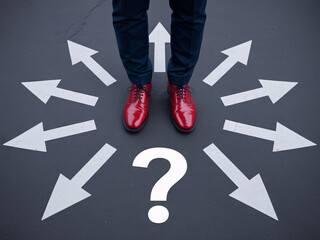 Fototapeta premium Man in red shoes standing at crossroads with question mark