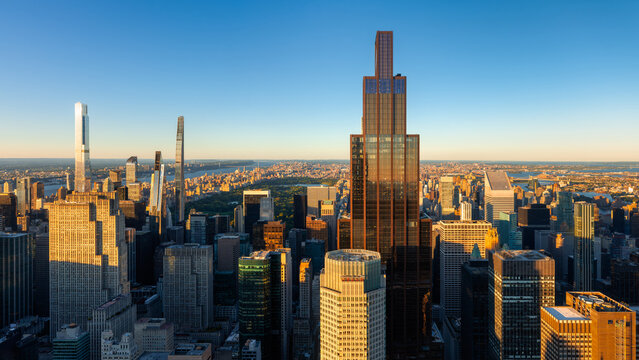Elevated view of the Midtown Manhattan skyline before sunset. New York City urban cityscape with supertall and modern skyscrapers