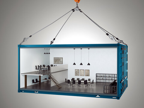 Industrial shipping container converted into a modern two-story office space with meeting rooms and workspace, suspended by crane hooks.