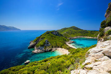 Obraz premium View of the beach with crystal clear and azure water in Porto Timoni on the Greek island of Corfu, background or wallpaper