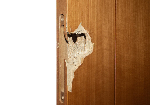 Damaged Wooden Door With Broken Lock Area and Hole From Forced Entry isolated on a white background