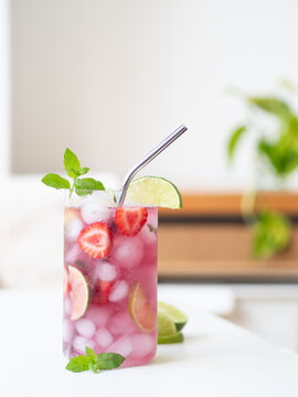 Refreshing strawberry mojito mocktail with lime and mint