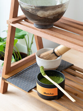 Matcha tea powder and accessories for traditional japanese ceremony