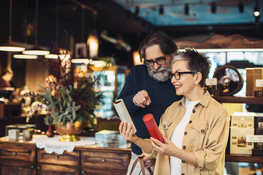 Senior couple choosing products in a boutique store