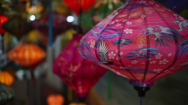 Colorful red and golden decorative elements sold on an vietnamese street market prior to the Tet holiday or Lunar new year in Vietnam, Asia. Selective focus close up video.