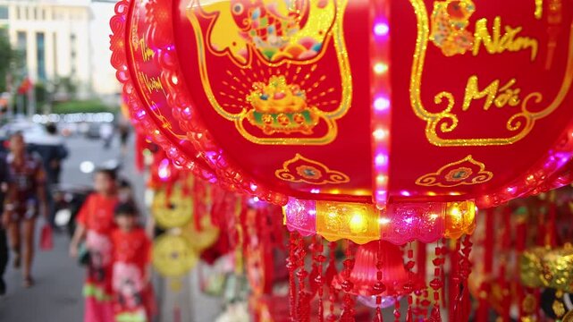 Colorful red and golden decorative elements sold on an vietnamese street market prior to the Tet holiday or Lunar new year in Vietnam, Asia. Selective focus close up video.