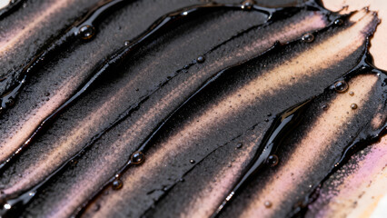 Macro Texture of Thick Black Sesame Paste or Squid Ink Sauce with Swirls and Glossy Bubbles