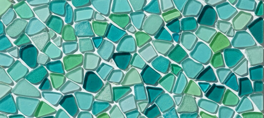 Handcrafted turquoise mosaic composed of sea glass in blue and green tones, creating an organic abstract pattern ideal for eco interior design, texture, and craft projects.