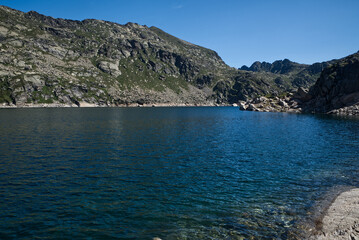Fototapeta premium Estany Primer de Juclar lake in Pyrenees mountains in Andorra