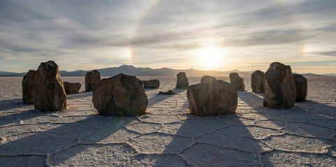 Ancient Stone Circle in Desert Landscape - Dramatic shadows under cloudy sky