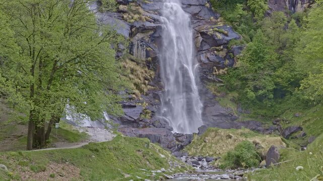 Twin waterfalls that plunge into the valley, Acquafraggia waterfall, Borgonuovo, Lombardy, Italy.