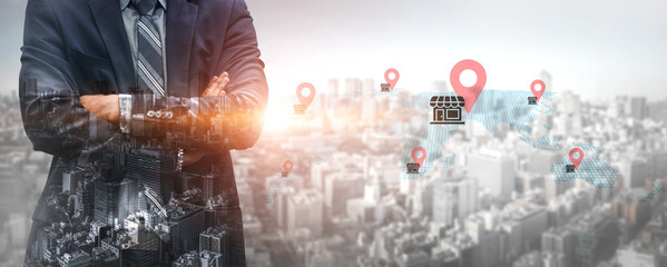 A businessman stands confidently in front of a city skyline, surrounded by digital location markers, symbolizing retail opportunities and urban expansion. Gantry © InfiniteFlow