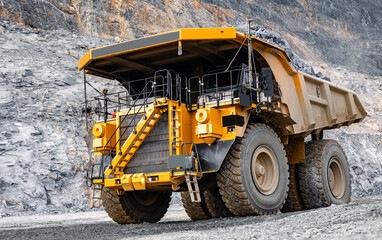 Massive Mining Dump Truck in Rocky Quarry Environment © Parilov