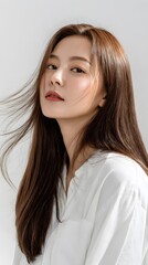 A young Asian woman with long brown hair.