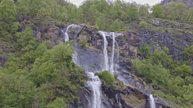Twin waterfalls that plunge into the valley, Acquafraggia waterfall, Borgonuovo, Lombardy, Italy.