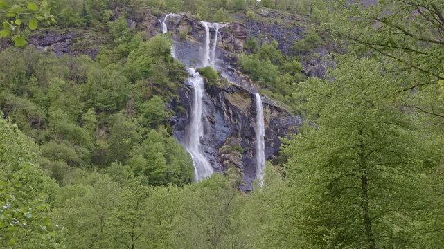 Twin waterfalls that plunge into the valley, Acquafraggia waterfall, Borgonuovo, Lombardy, Italy.