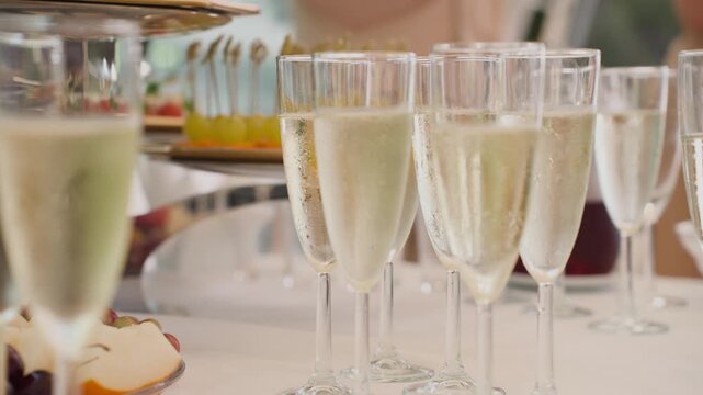 Glasses of champagne on the street, slow motion
