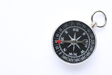 One compass on white background, top view. Space for text