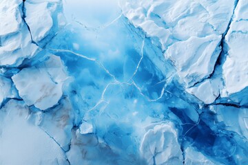 Obraz premium Cracked ice sheets reveal deep blue fissures and textures. The cool tones and intricate patterns highlight nature's delicate beauty.