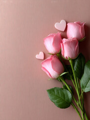 Fototapeta premium Pink roses with heart decorations on textured background