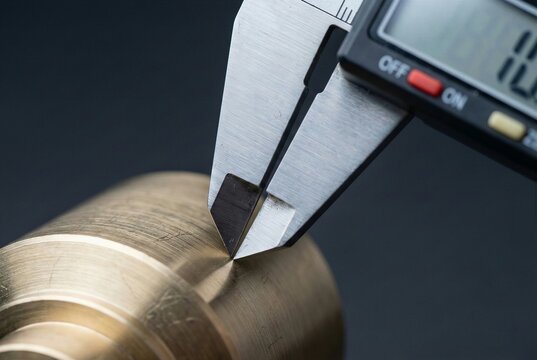 Precision dimensional measurement of CNC machined brass component using digital caliper