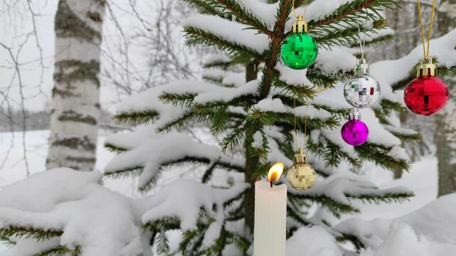 New Year's toys and a candle on the tree